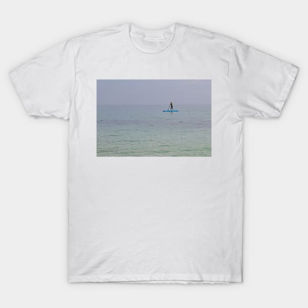 Paddle boarder in the sea off the Isle of Herm, Channel Islands T-Shirt by HazelWright